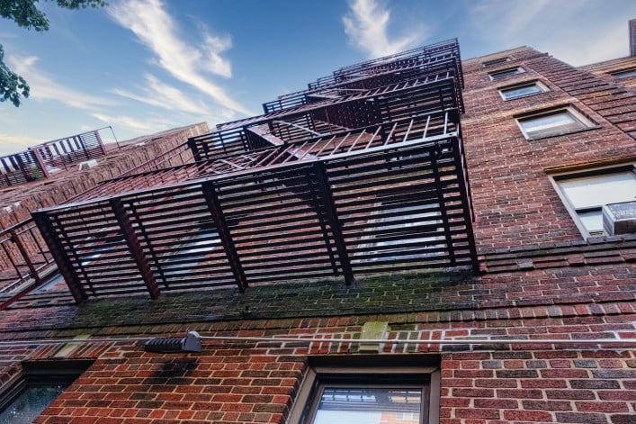 Fire escape on brick apartment building in NYC Fire escape on brick apartment building in NYC