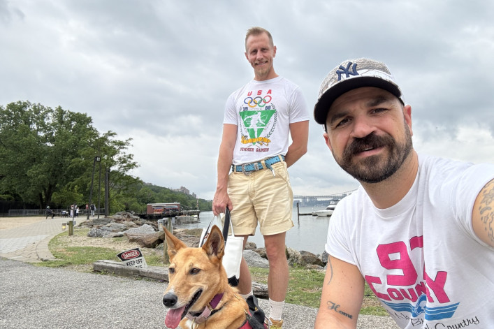 Matthew Conley and Paul Passavant and their pup, Sting Rae. Paul Passavant and Matthew Conley with their pup, Sting Rae.