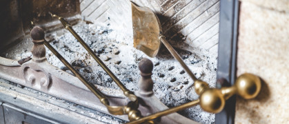fireplace with cleaning tools