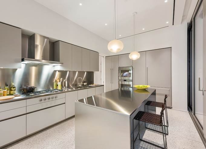 A home with a spotless—and space-enhancing—stainless steel kitchen
