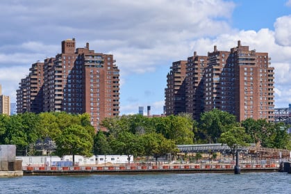 Towers of the East River Co-ops (1956) in the Lower East Side, NYC. In the foreground is the East River and East River Park under renovation. These were the tallest reinforced concrete apartment structures in the United States at the time of their construction.