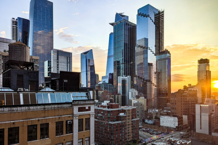 New York City - glass skyscrapers in Hudson Yards with sunlight shining in the skyline background