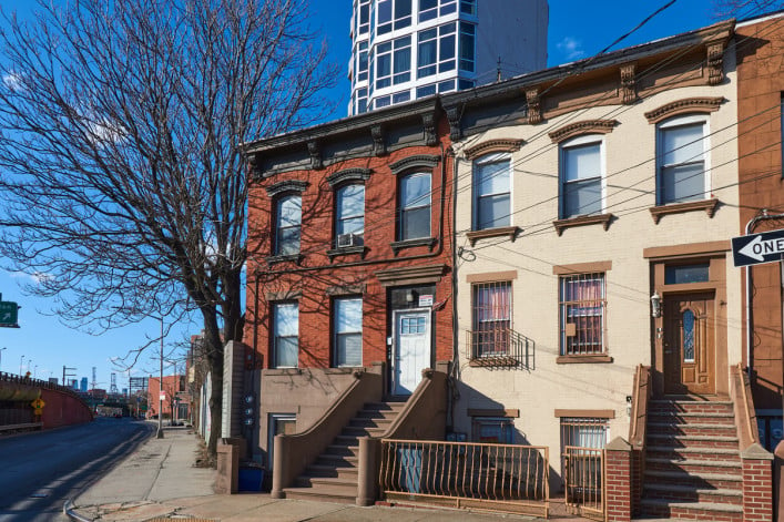 Brick rowhouses on Nelson St. in Carroll Gardens, Brooklyn, NYC adjacent to the expressway