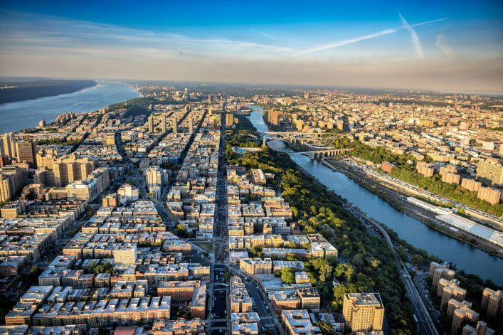 The northern portion of Manhattan Island, New York City including the neighborhoods of Harlem, Washington Heights, and Inwood bordered between the Hudson and Harlem Rivers. The western portion of the Bronx in view as well. This was shot via helicopter from an altitude of about 1200 feet over the city.