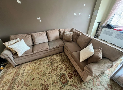 The author's well-worn, six-seater Ethan Allen sleeper couch