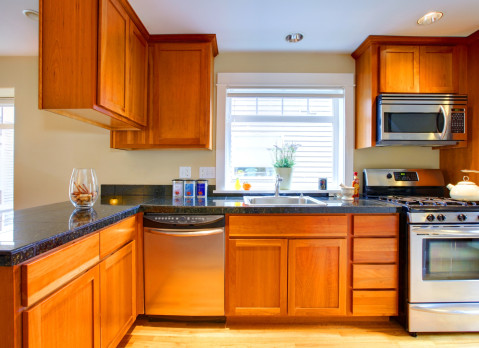 dated orange wood cabinets brick underground