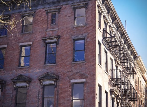 A red brick Brooklyn multifamily apartment building