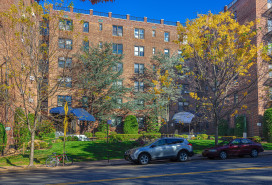 Large 6 Story Red Brick Co-op Apartment Building on Shore Road in Bay Ridge Neighborhood of Brooklyn, New York, USA. SUV parked on the street in front of the building. Canon EOS 6D (full Frame Sensor) Camera and Canon EF 24-105mm F/4L IS Lens. HDR image.
