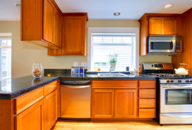 dated orange wood cabinets brick underground