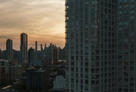 Evening view of Hunters Point waterfront and Manhattan over the East River from a modern condo in Long Island City, Queens.