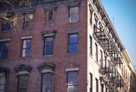 A red brick Brooklyn multifamily apartment building