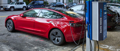 Recharging an electric car at a curbside NYC charger stock photo