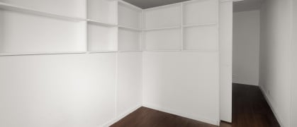 L-shaped divider with shelves and a sliding door from Manhattan Pressurized Walls L-shaped divider with shelves and a sliding door from Manhattan Pressurized Walls