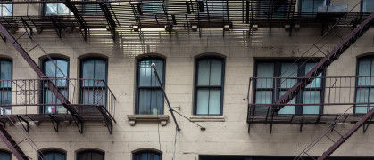 In Manhattan, a glimpse at a New York city residential building, with its famous exterior fire escape staircase.