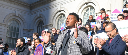 Chi Ossé on the steps of the New York City Council ahead of an afternoon vote on his FARE Act.