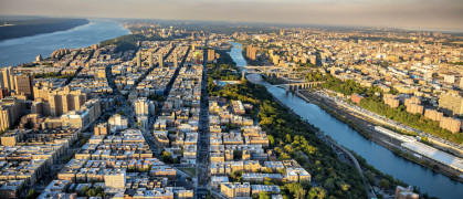 The northern portion of Manhattan Island, New York City including the neighborhoods of Harlem, Washington Heights, and Inwood bordered between the Hudson and Harlem Rivers. The western portion of the Bronx in view as well. This was shot via helicopter from an altitude of about 1200 feet over the city.