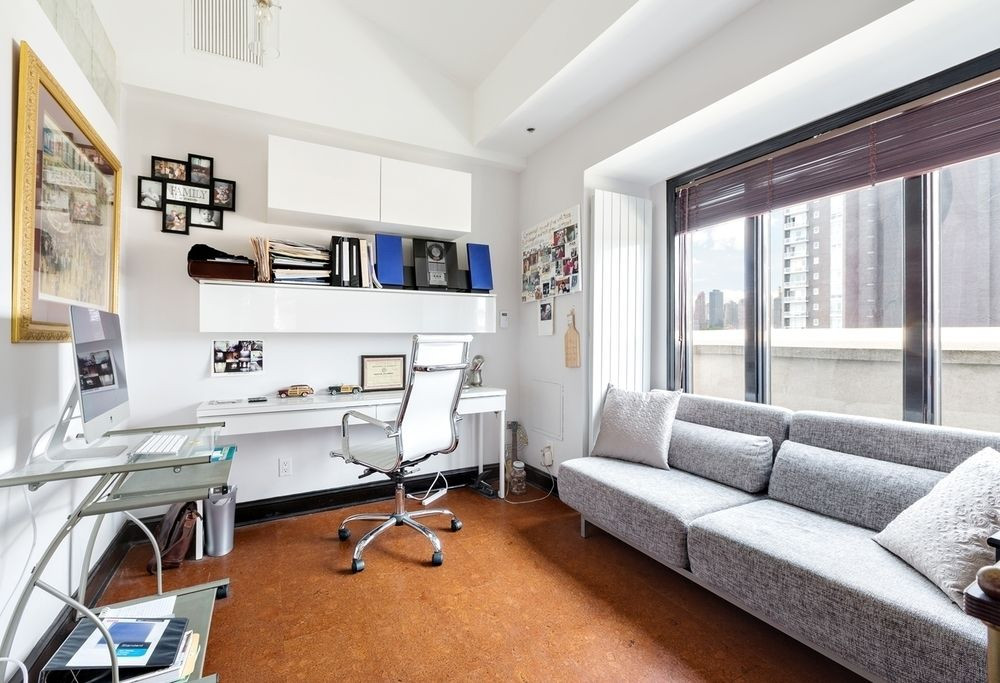 This Astoria duplex comes with a roof deck, balcony, and heated parking